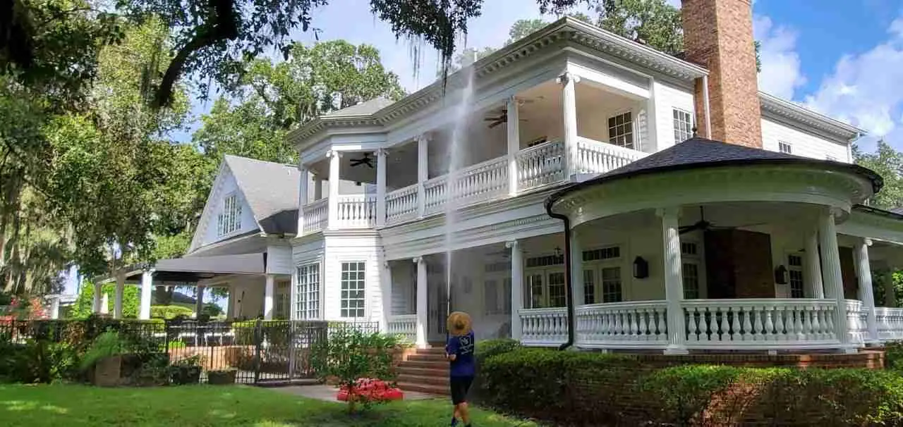 House washing service with soft wash method for siding and exterior walls